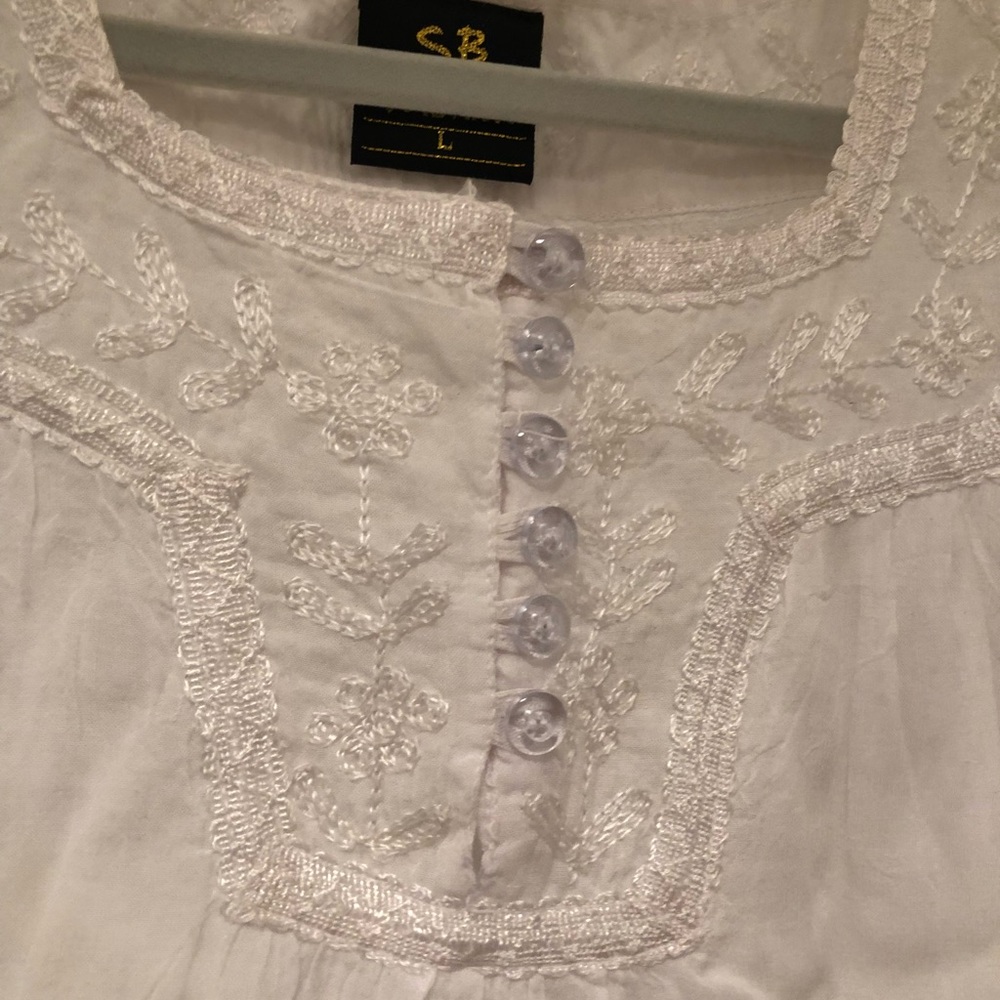 White gauzy summer shirt.